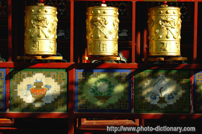 golden prayer wheels - photo/picture definition - golden prayer wheels word and phrase image