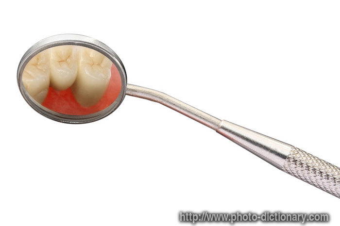dental mirror - photo/picture definition - dental mirror word and phrase image