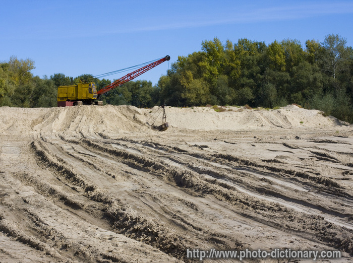 dredge on sand - photo/picture definition - dredge on sand word and phrase image