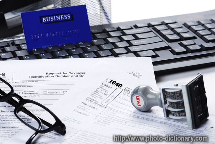 filling tax return - photo/picture definition - filling tax return word and phrase image