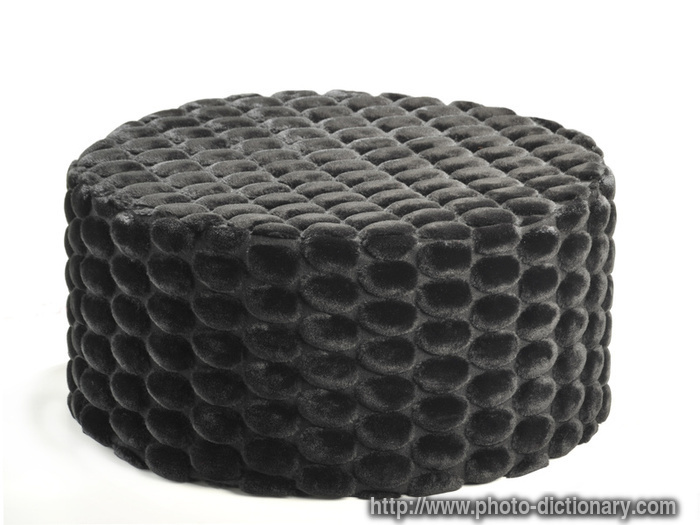 black pouf - photo/picture definition - black pouf word and phrase image