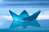 blue paper boat - photo/picture definition - blue paper boat word and phrase image