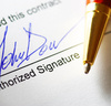 signing a contract - photo/picture definition - signing a contract word and phrase image