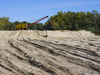 dredge on sand - photo/picture definition - dredge on sand word and phrase image