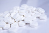 white pills - photo/picture definition - white pills word and phrase image